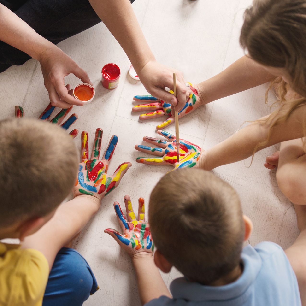 teacher works with children according to the Montessori method a